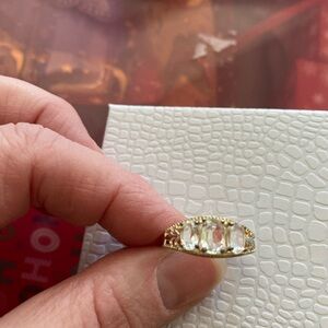 Sterling silver 3 stone ring. Gold with clear diamond-type stones costume piece